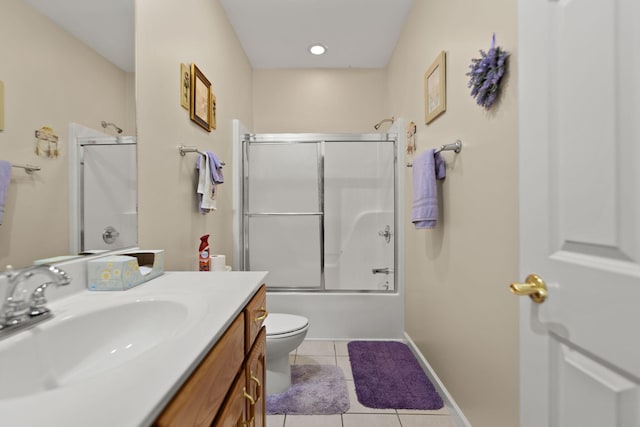 full bathroom with vanity, tile patterned floors, shower / bath combination with glass door, and toilet