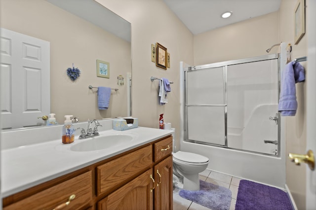 full bathroom with tile patterned flooring, vanity, toilet, and combined bath / shower with glass door