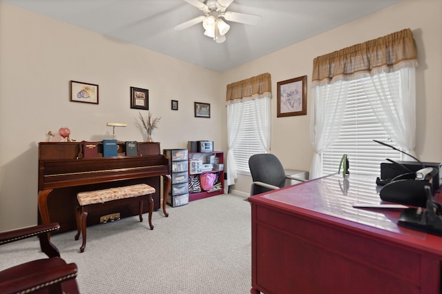 home office featuring light colored carpet and ceiling fan
