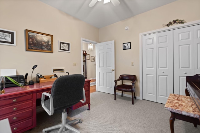 office space featuring light carpet and ceiling fan