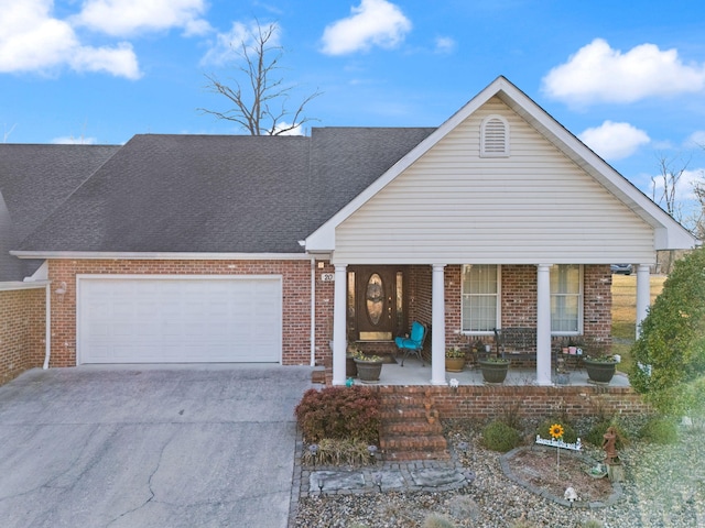 view of front of property with a garage and covered porch