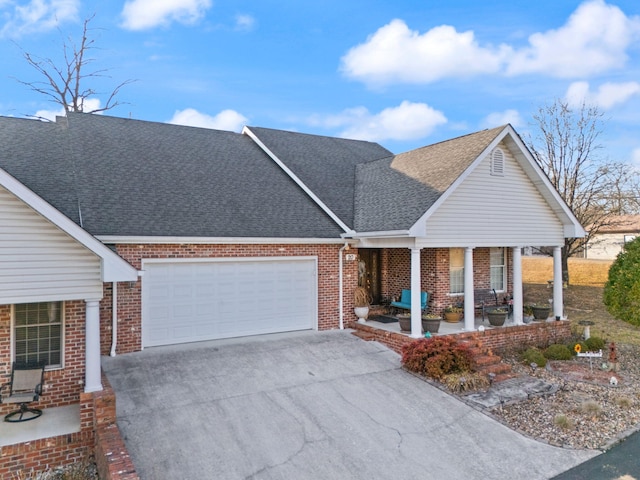 view of front of home with a garage and a porch