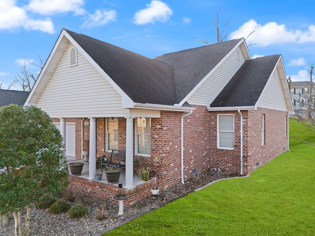back of property featuring a patio and a lawn