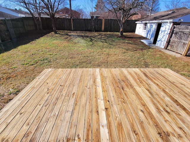 wooden deck with a lawn