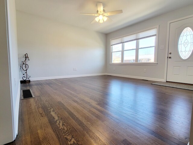 foyer entrance with dark wood-type flooring