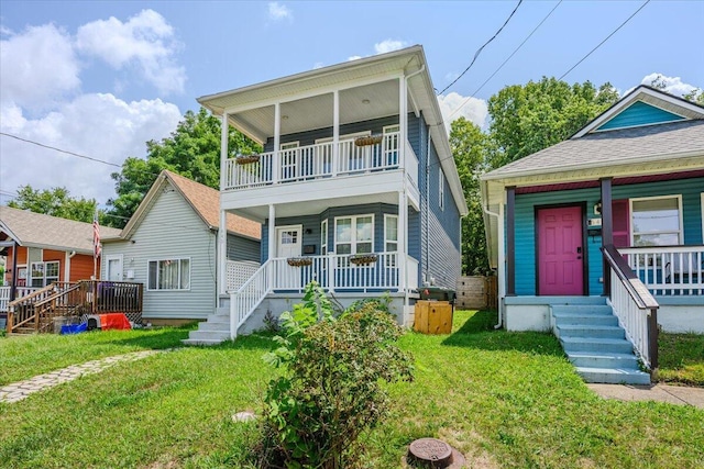 view of front of property with a balcony, covered porch, and a front lawn