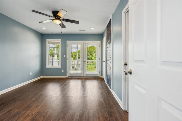 doorway featuring dark wood-type flooring, ceiling fan, and french doors