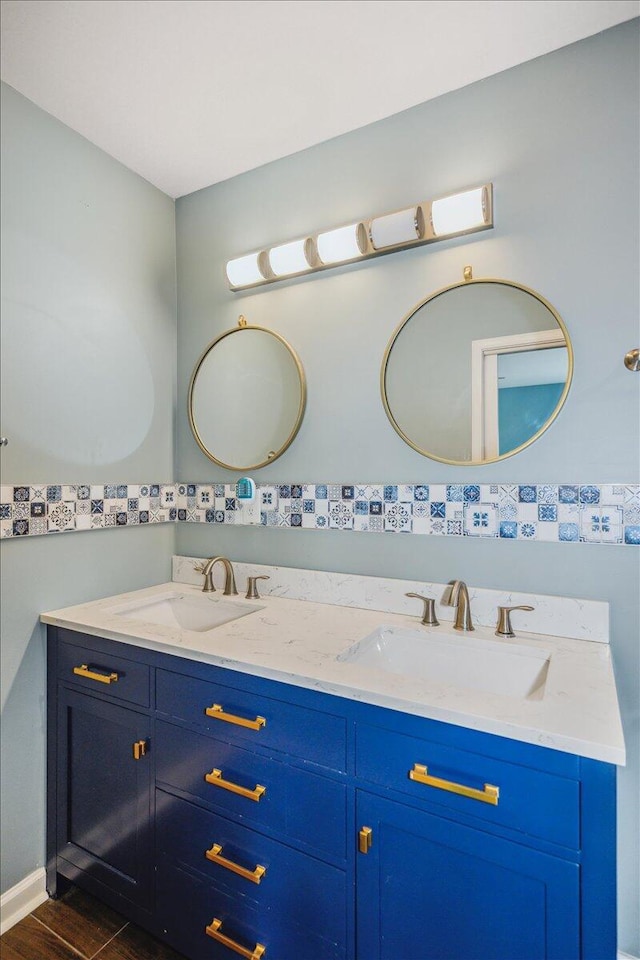 bathroom featuring hardwood / wood-style flooring and vanity