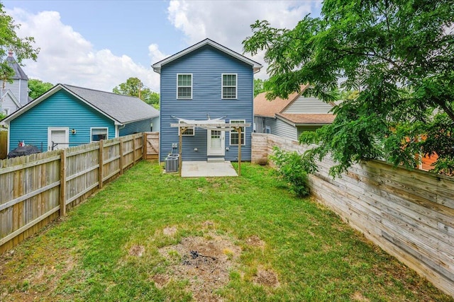 back of property featuring a patio, central AC unit, and a lawn