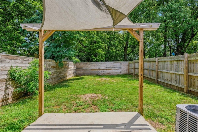 view of yard featuring a patio and central air condition unit