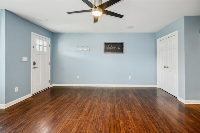 entrance foyer with dark wood-type flooring and ceiling fan