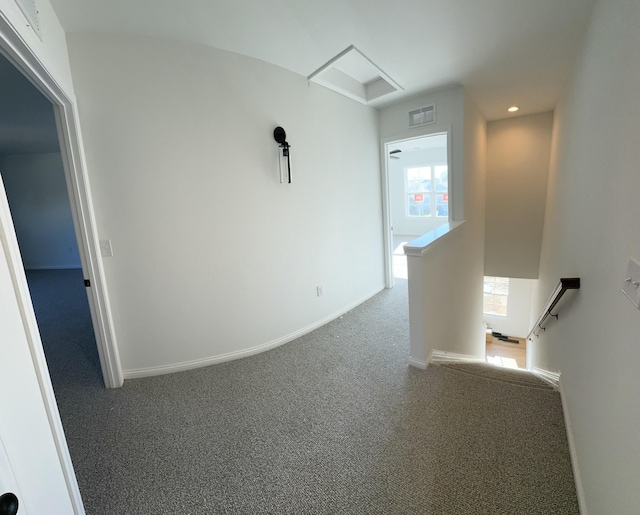 hallway with carpet flooring