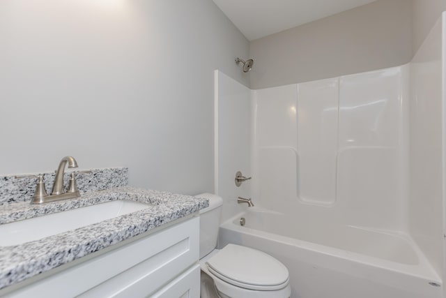 full bathroom with vanity, tub / shower combination, and toilet