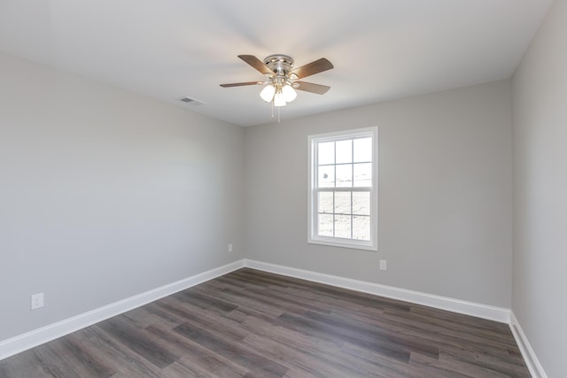 unfurnished room featuring dark hardwood / wood-style floors and ceiling fan