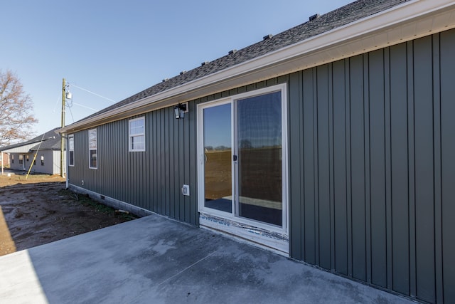 view of side of home with a patio area