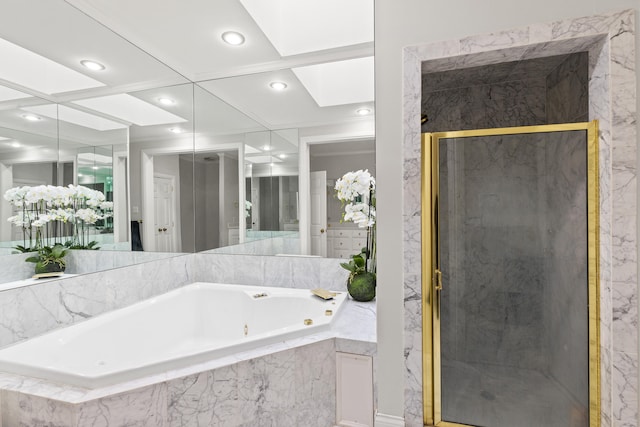 bathroom featuring plus walk in shower and a skylight