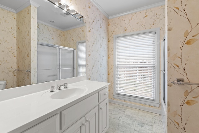 bathroom featuring crown molding, an enclosed shower, and vanity