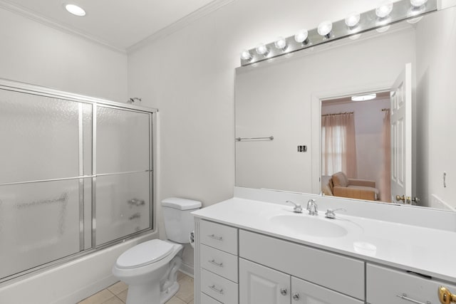 full bathroom featuring shower / bath combination with glass door, tile patterned flooring, vanity, ornamental molding, and toilet