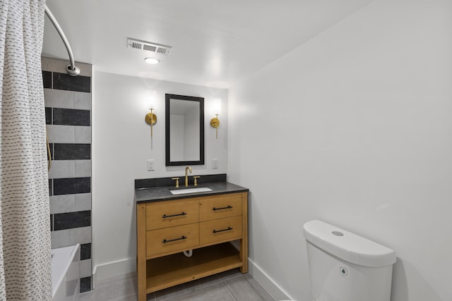 full bathroom featuring vanity, toilet, and shower / bath combo