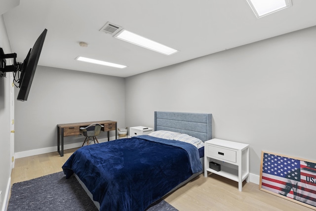 bedroom featuring light wood-type flooring