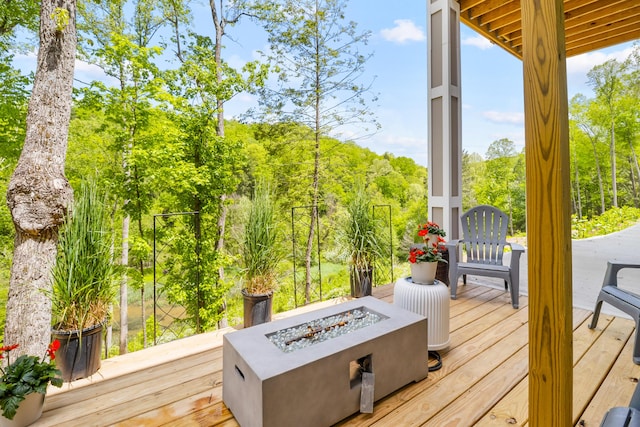 780 Lake Rd, London, KY 40741 - wooden deck featuring an outdoor fire pit and view of scattered trees