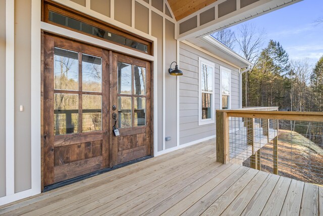 wooden deck featuring french doors