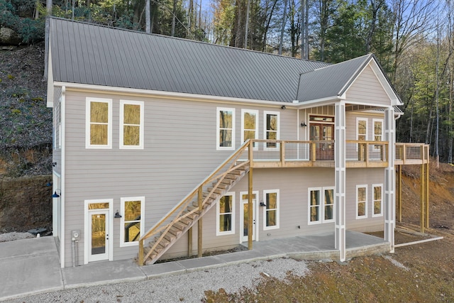 back of house with a patio area and a balcony