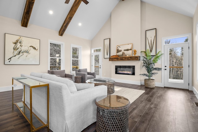 living room featuring beam ceiling, ceiling fan, dark wood-type flooring, and high vaulted ceiling