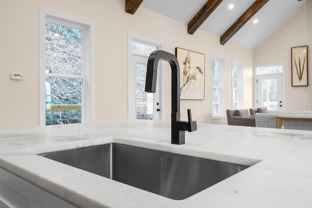 780 Lake Rd, London, KY 40741 - kitchen view of a sink, beam ceiling, recessed lighting, and light stone countertops