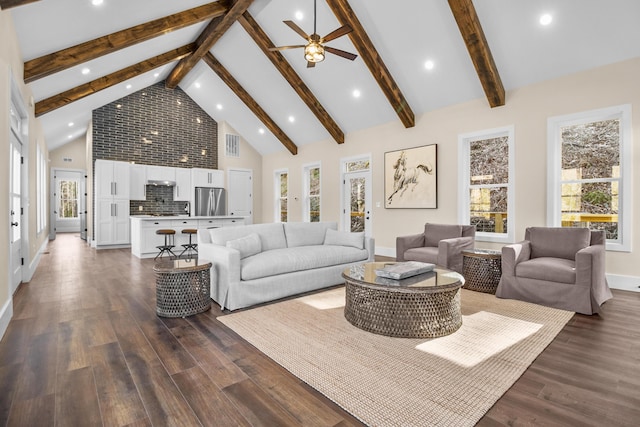 living room featuring beamed ceiling, plenty of natural light, dark hardwood / wood-style floors, and high vaulted ceiling