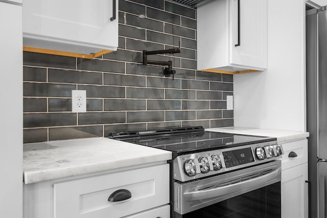 780 Lake Rd, London, KY 40741 - kitchen featuring stainless steel appliances, white cabinetry, tasteful backsplash, and light stone countertops
