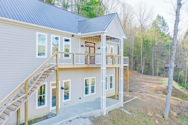 back of property with a balcony