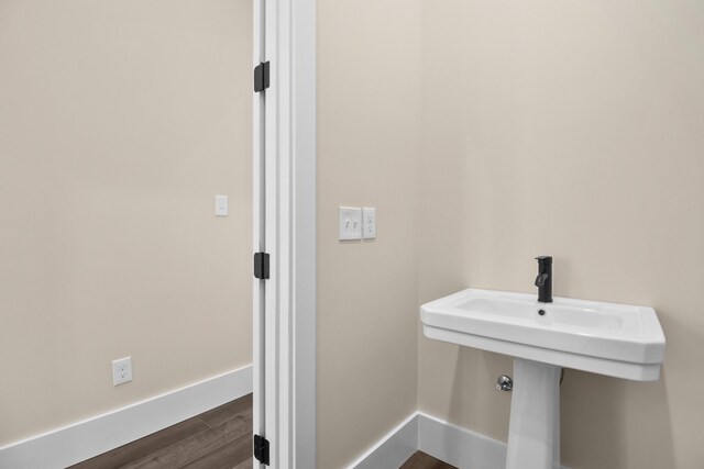 bathroom featuring hardwood / wood-style flooring and sink