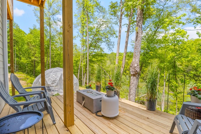 780 Lake Rd, London, KY 40741 - wooden deck featuring an outdoor fire pit and view of scattered trees