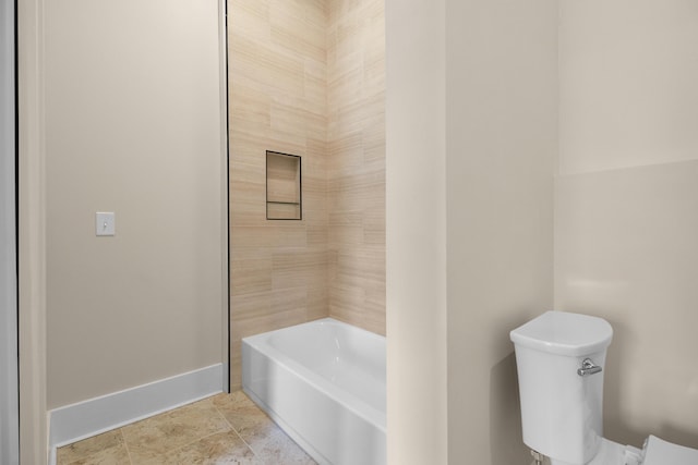 bathroom featuring toilet and a bathtub