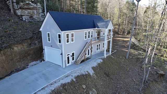 back of house with a garage