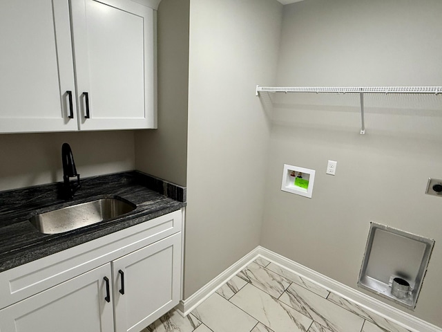 laundry room with hookup for a washing machine, sink, hookup for an electric dryer, and cabinets