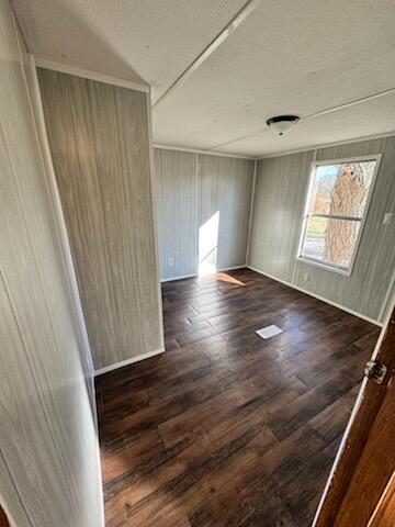222 Ore Mines Rd, Owingsville, KY 40360 - unfurnished room with a textured ceiling and wood finished floors