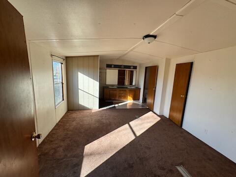 222 Ore Mines Rd, Owingsville, KY 40360 - unfurnished room with lofted ceiling and carpet