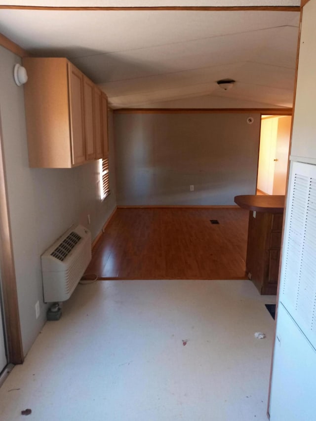 interior space featuring light wood finished floors and a wall mounted AC