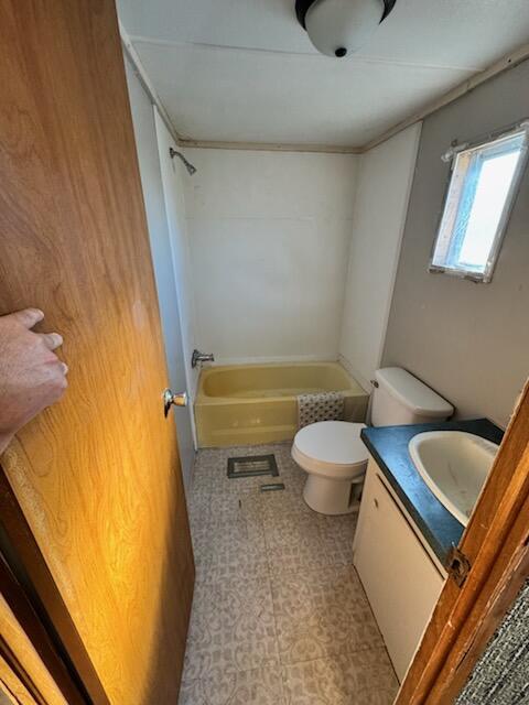 222 Ore Mines Rd, Owingsville, KY 40360 - bathroom featuring tile patterned floors, shower / bathing tub combination, toilet, and vanity