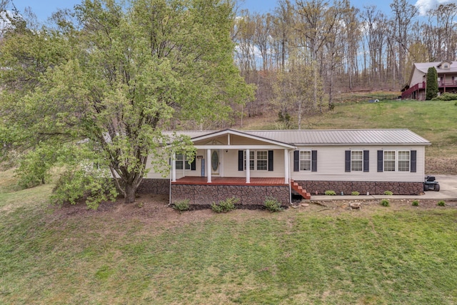 579 Fraley Rd, Salt Lick, KY 40371 - view of front of house with a porch, a front lawn, and metal roof