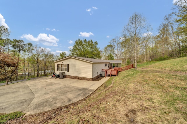 579 Fraley Rd, Salt Lick, KY 40371 - view of side of property with a lawn and a deck