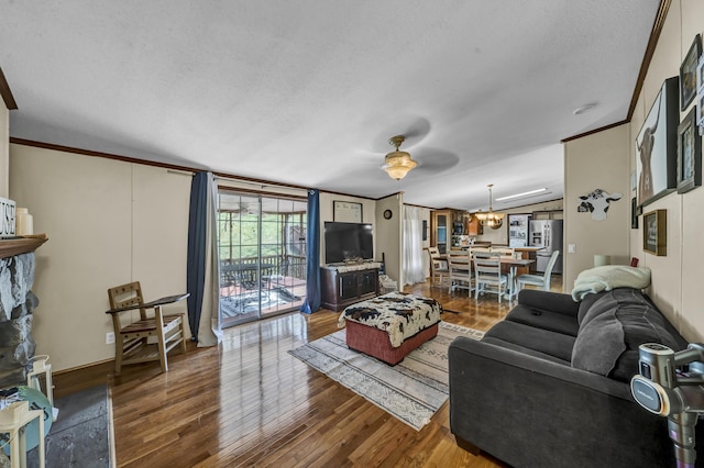 579 Fraley Rd, Salt Lick, KY 40371 - living area with wood finished floors, a textured ceiling, and crown molding