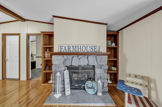 579 Fraley Rd, Salt Lick, KY 40371 - living area featuring vaulted ceiling, crown molding, wood finished floors, and a fireplace