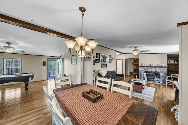 579 Fraley Rd, Salt Lick, KY 40371 - dining room featuring ceiling fan with notable chandelier, wood finished floors, ornamental molding, a stone fireplace, and pool table