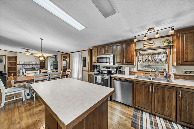 579 Fraley Rd, Salt Lick, KY 40371 - kitchen featuring hardwood / wood-style flooring, stainless steel appliances, light countertops, and a sink
