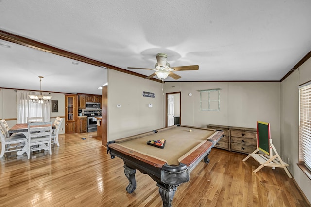 579 Fraley Rd, Salt Lick, KY 40371 - rec room with ceiling fan with notable chandelier, light wood-style flooring, and ornamental molding