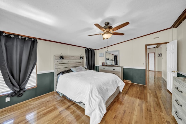 579 Fraley Rd, Salt Lick, KY 40371 - bedroom with vaulted ceiling, a ceiling fan, crown molding, a textured ceiling, and light wood-type flooring