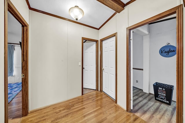 579 Fraley Rd, Salt Lick, KY 40371 - entryway featuring light wood-type flooring, lofted ceiling with beams, and ornamental molding